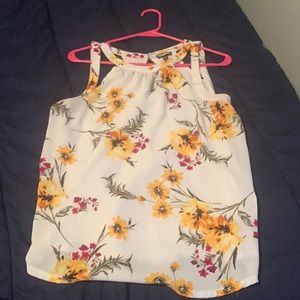 A white top with flowers on it